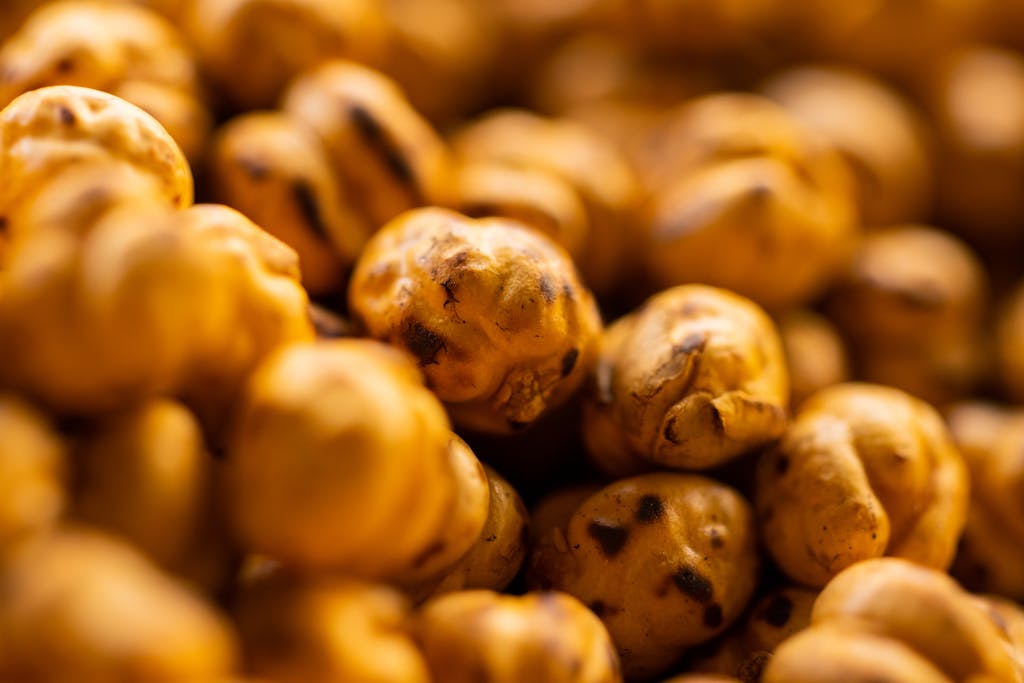 Macro shot of roasted chickpeas showcasing texture and warm hues.